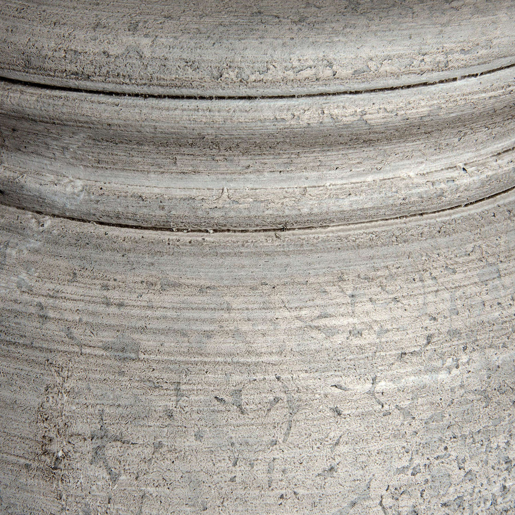 Close-up of a textured gray surface with concentric circular patterns