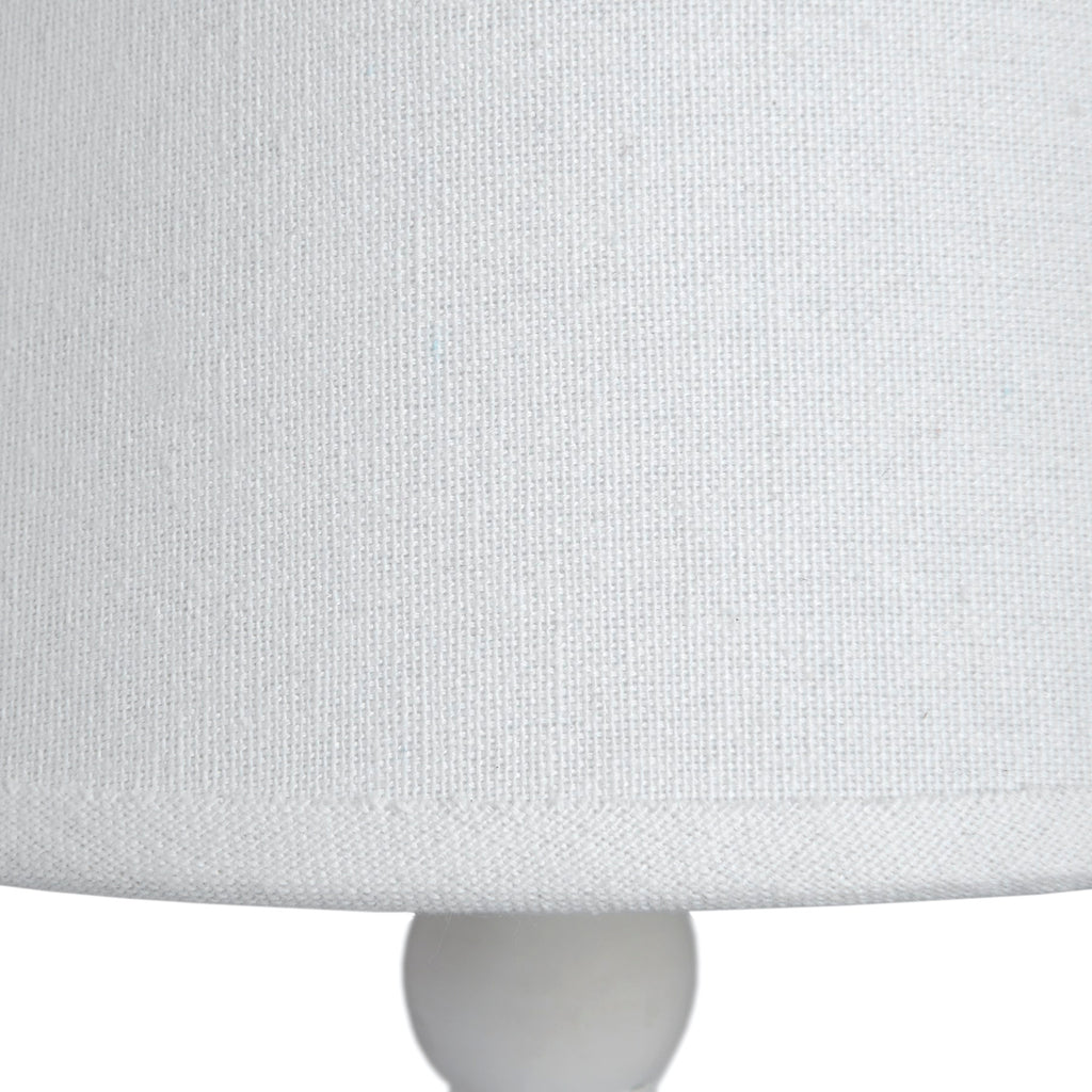 Close-up of a light gray fabric surface with a subtle pattern
