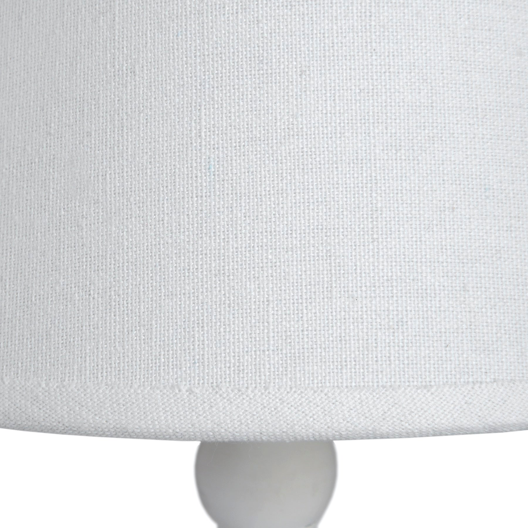 Close-up of a light gray fabric surface with a subtle pattern