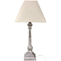 Table lamp with beige shade and wooden base on a white background