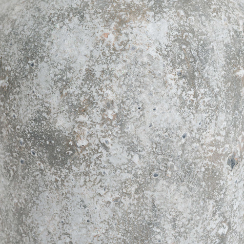 Close-up of a textured concrete surface with gray and brown tones.