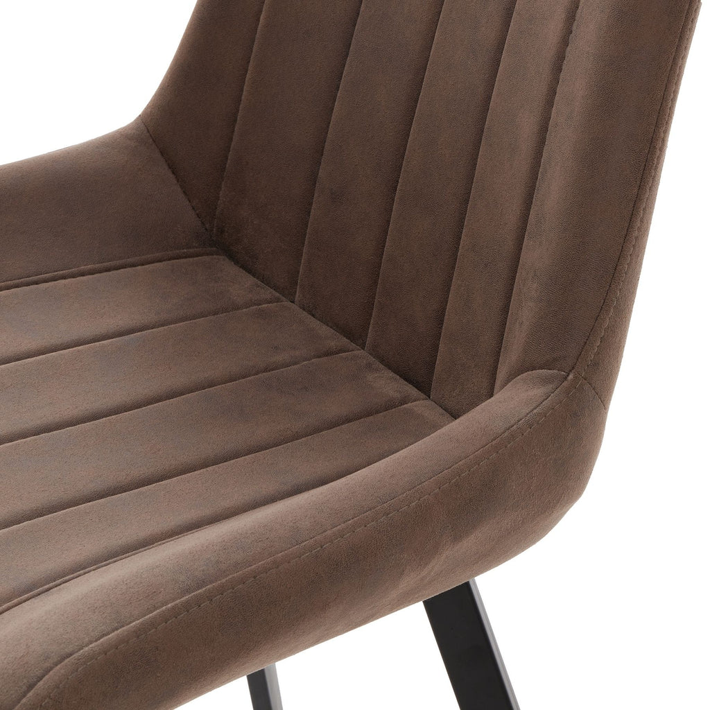 Brown velvet chair with black metal legs on a white background