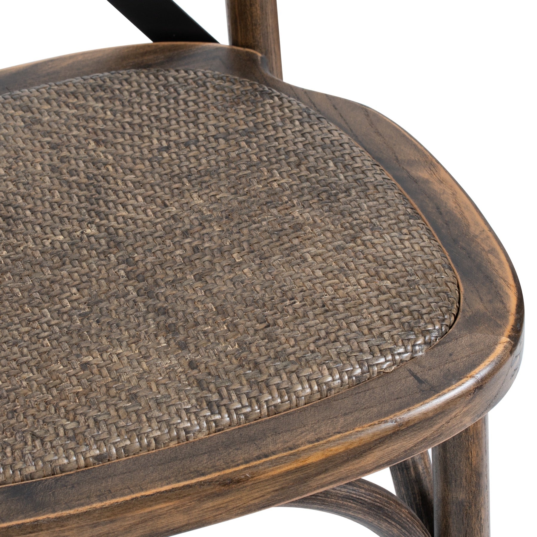 Close-up of a wooden chair with woven seat on a white background