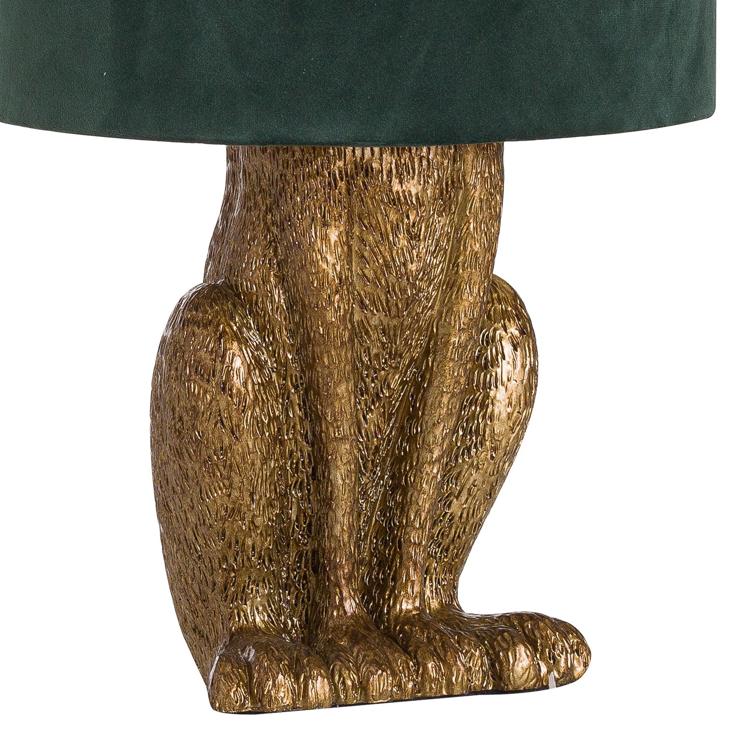 Gold owl-shaped table base with a green lampshade on a white background