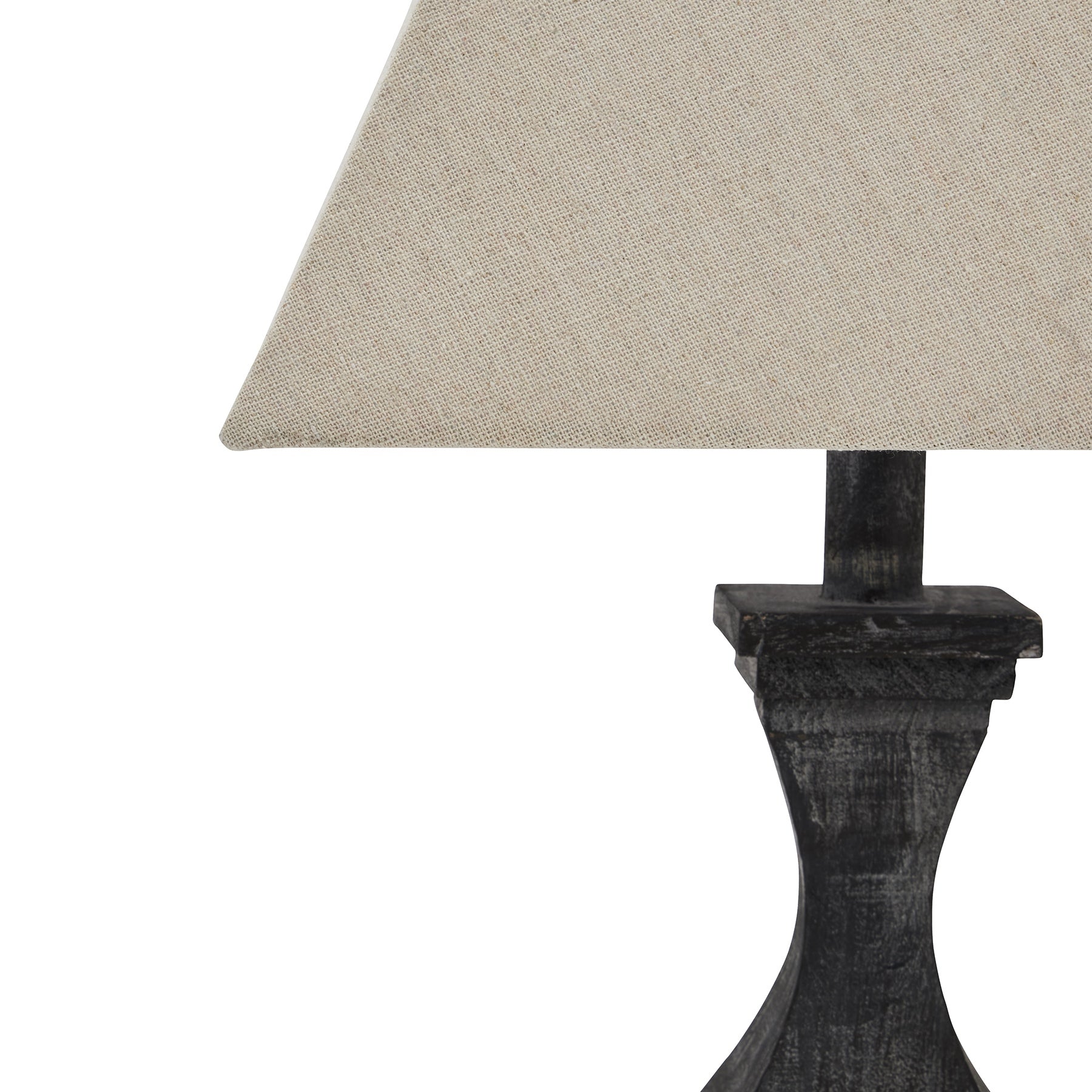 Table lamp with a dark wooden base and beige fabric shade on a white background