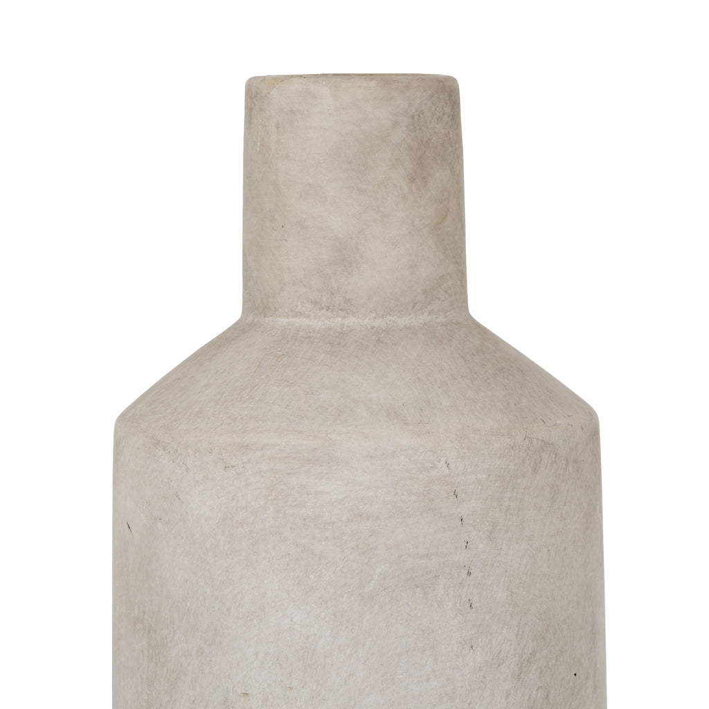 Beige textured vase on a white background