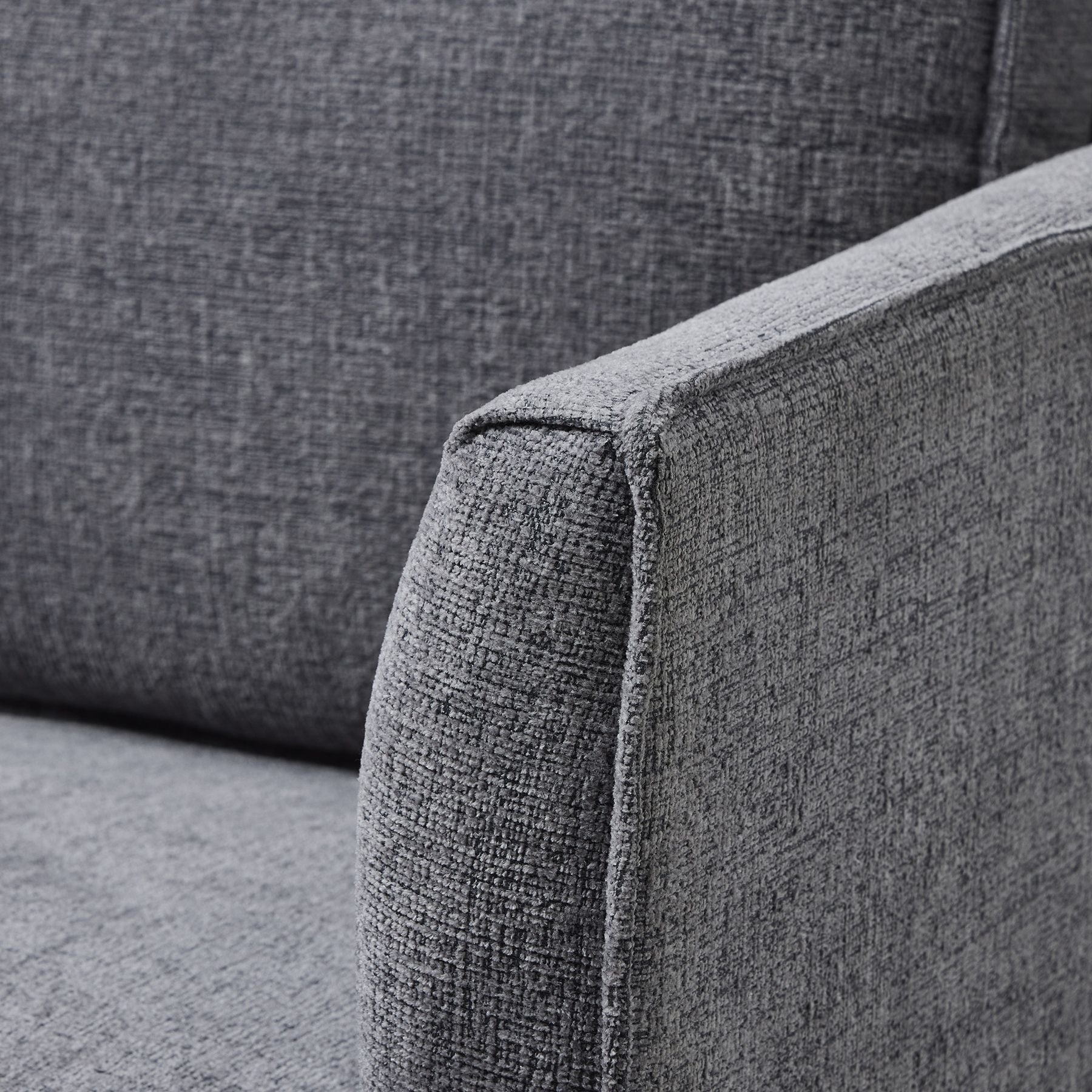 Gray fabric sofa corner with a textured pattern