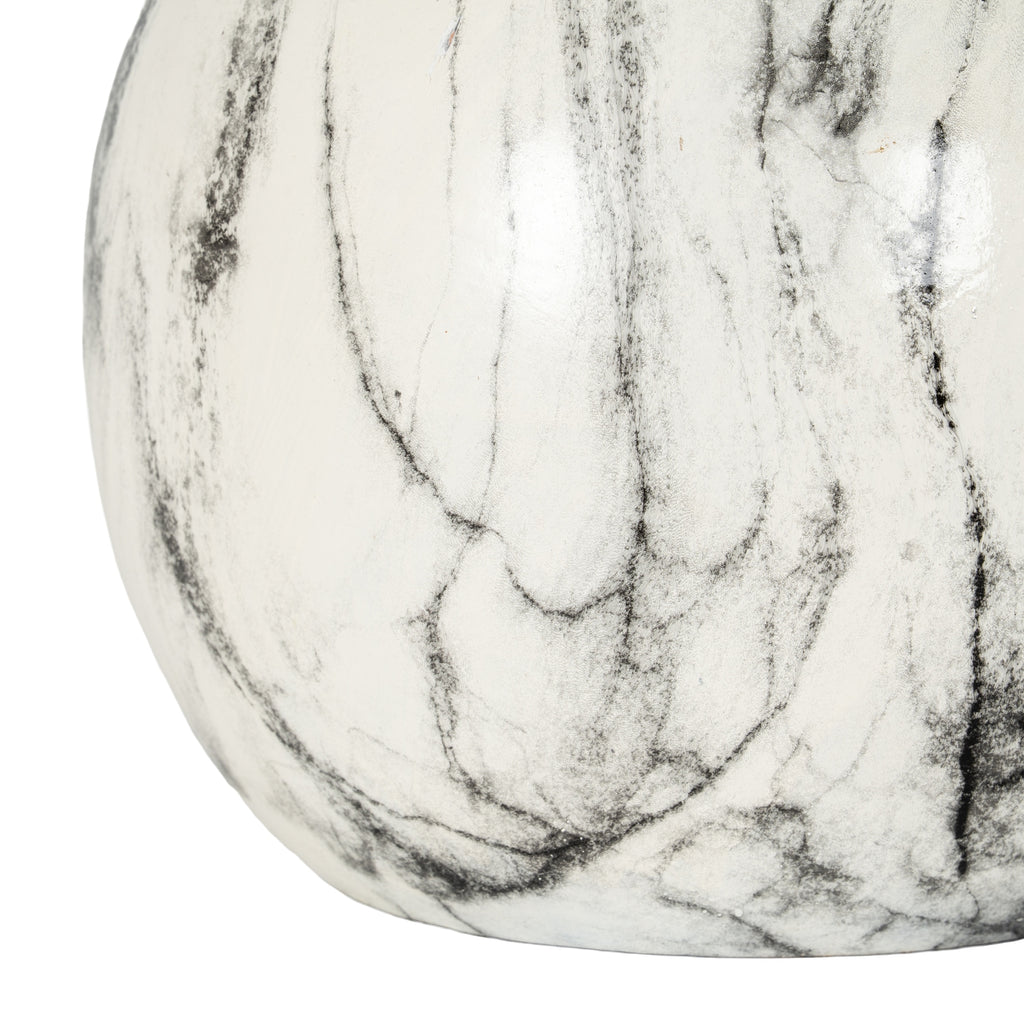 Close-up of a marble-patterned object on a white background