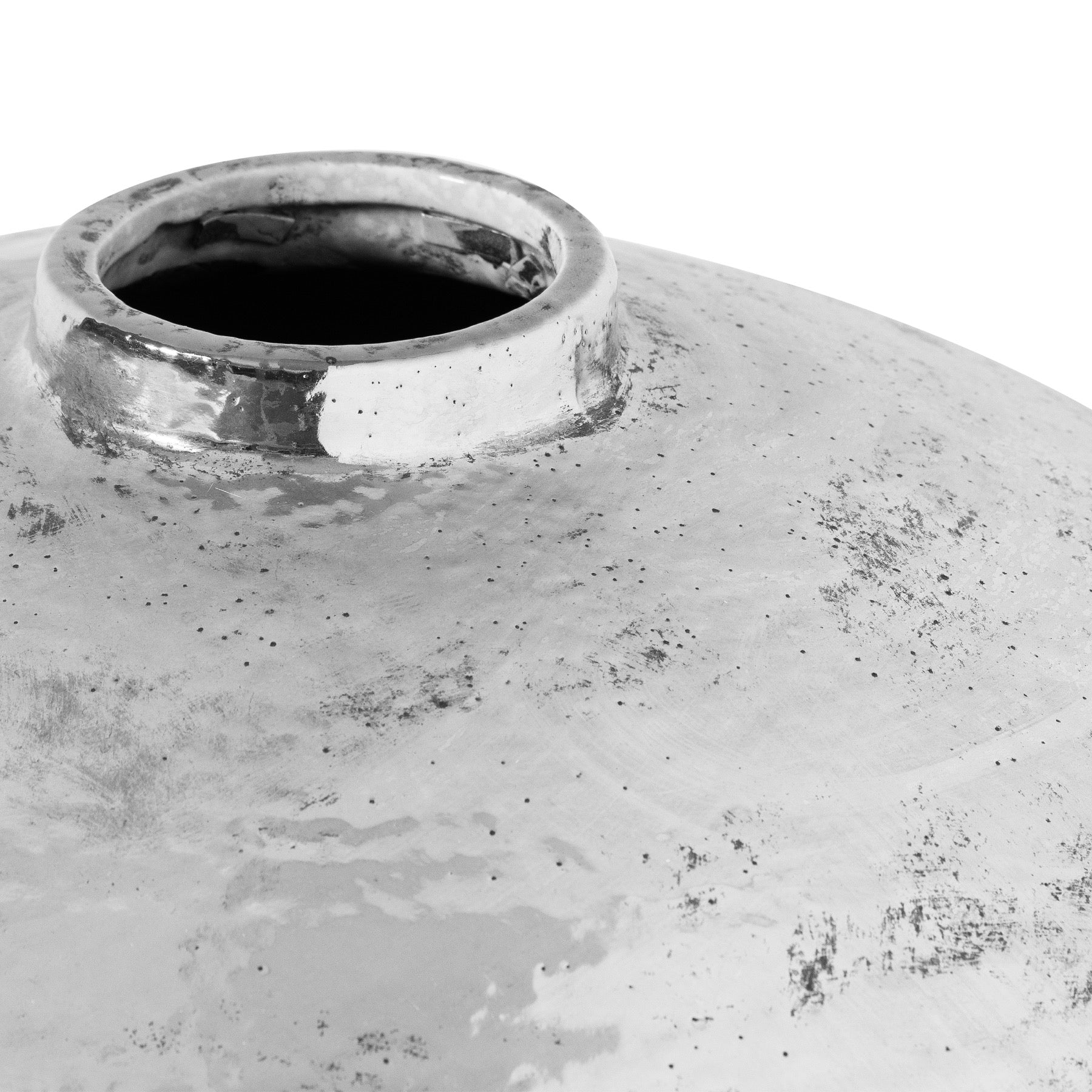 Close-up of a textured ceramic vase on a white background
