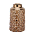 Decorative vase with a scalloped pattern on a white background