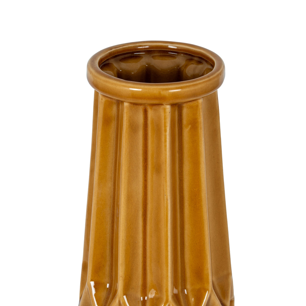 Brown ceramic vase with ribbed texture on a white background
