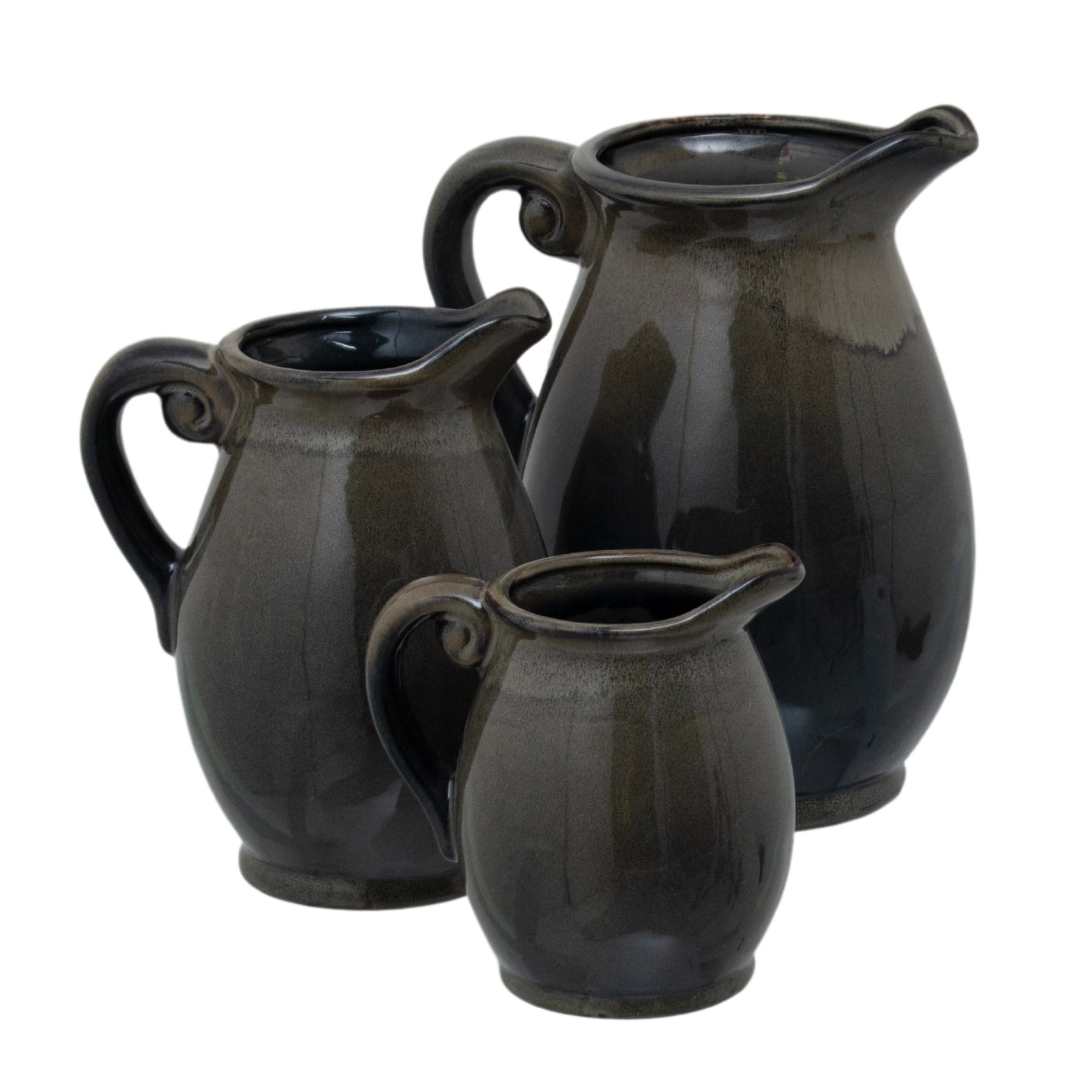 Three black ceramic pitchers of varying sizes on a white background