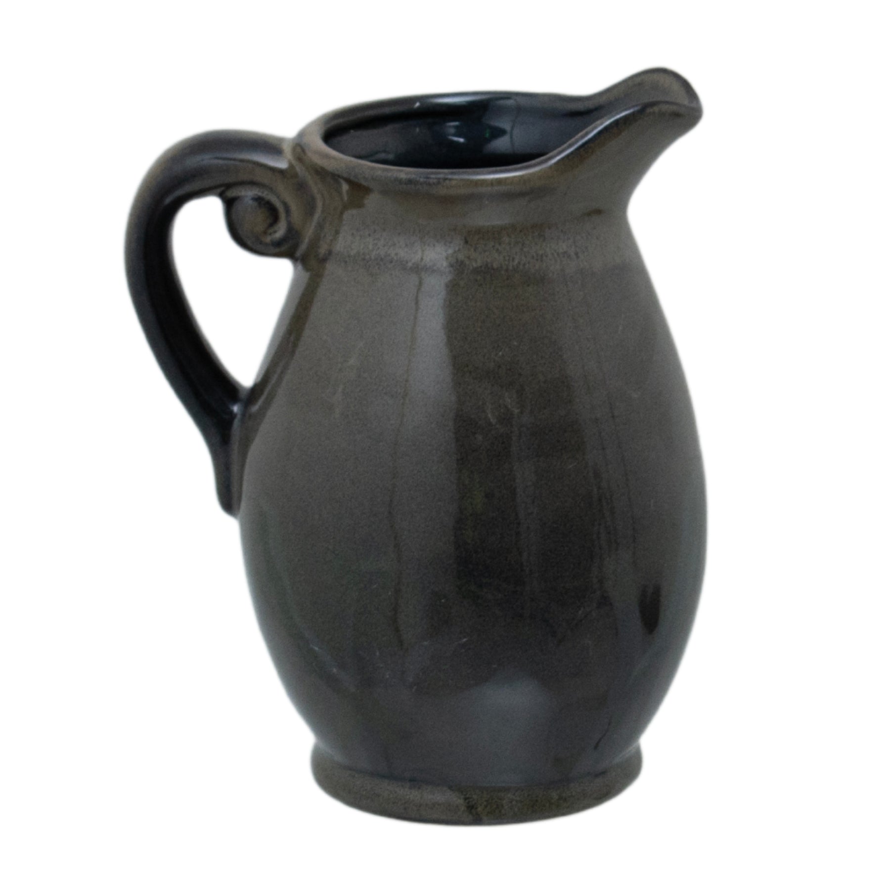 Black ceramic pitcher on a white background