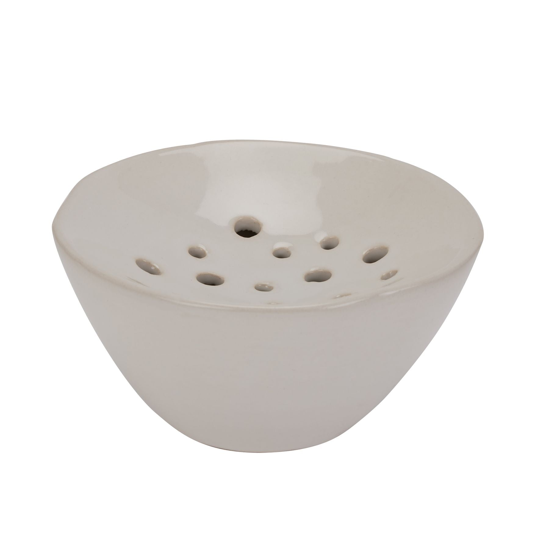 White ceramic bowl with holes on a white background