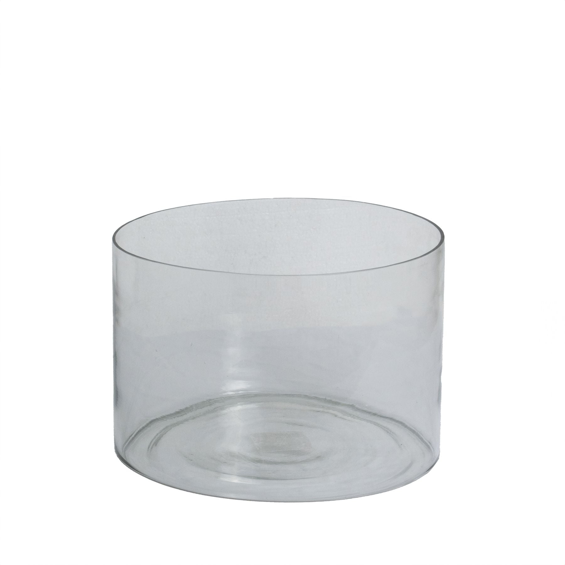 Clear glass cake stand on a white background