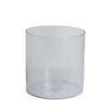 Clear cylindrical glass vase on a white background