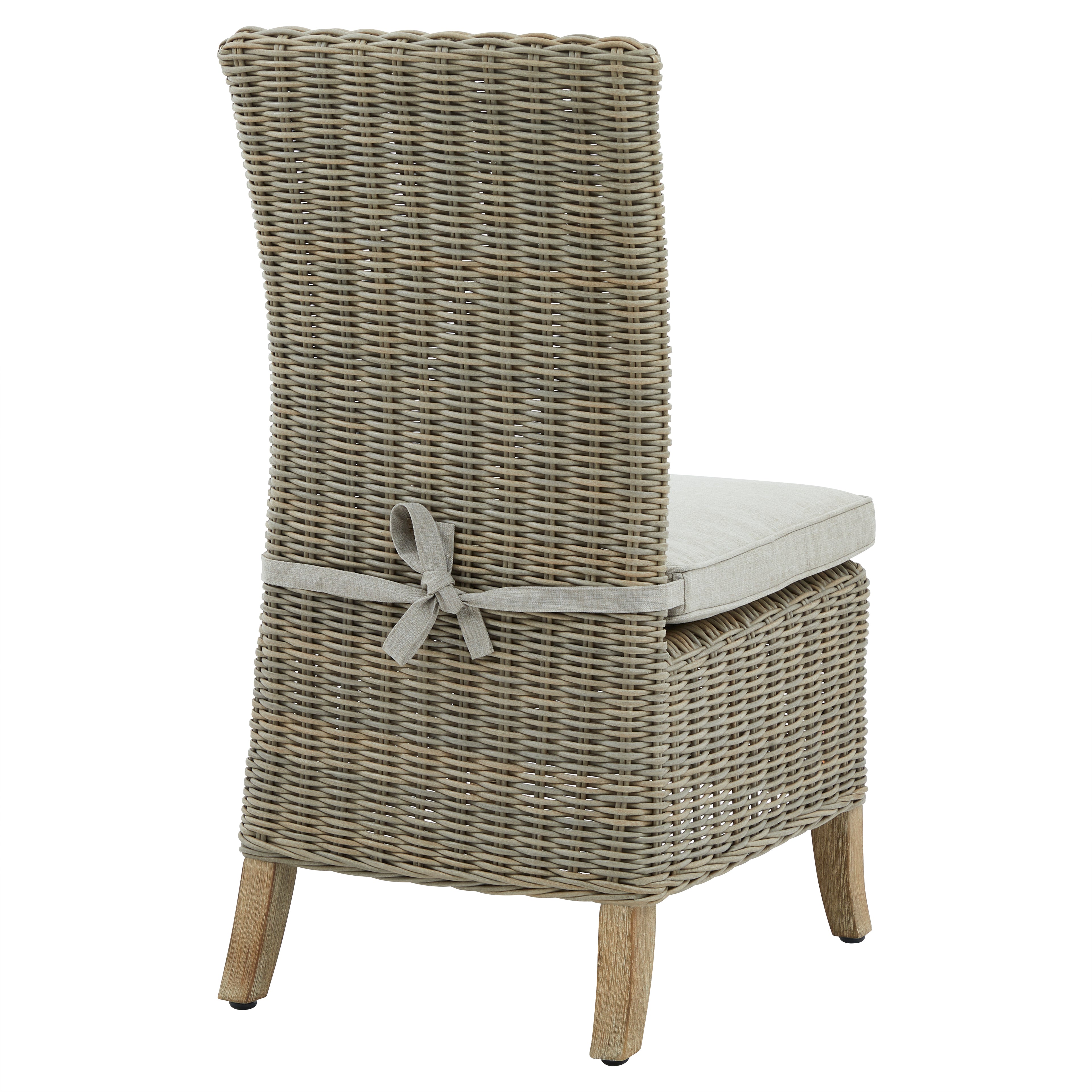 Wicker chair with a cushion on a white background