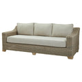 Wicker outdoor sofa with beige cushions on a white background