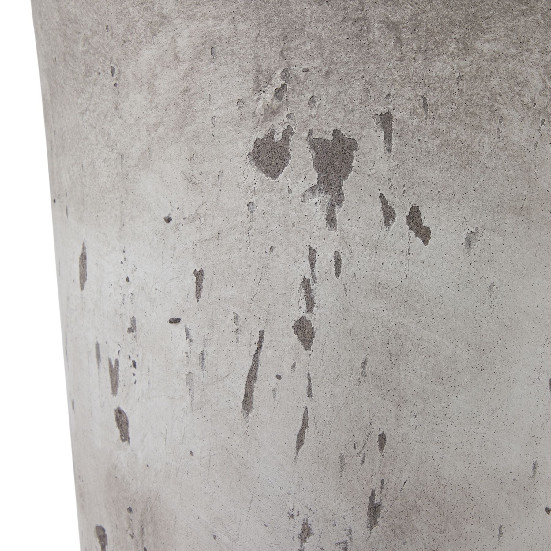Close-up of a textured concrete surface with variations in gray tones.