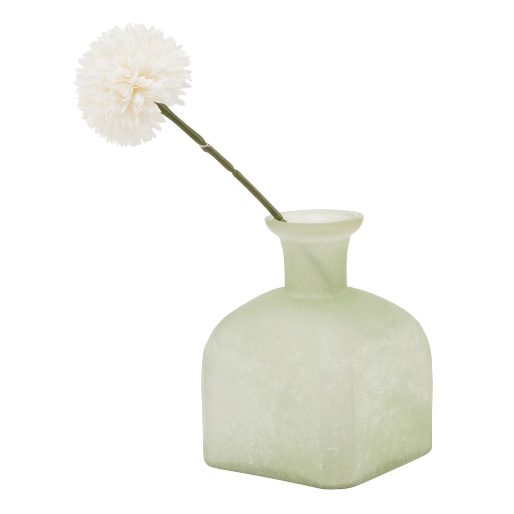Green vase with a white pom-pom flower on a white background