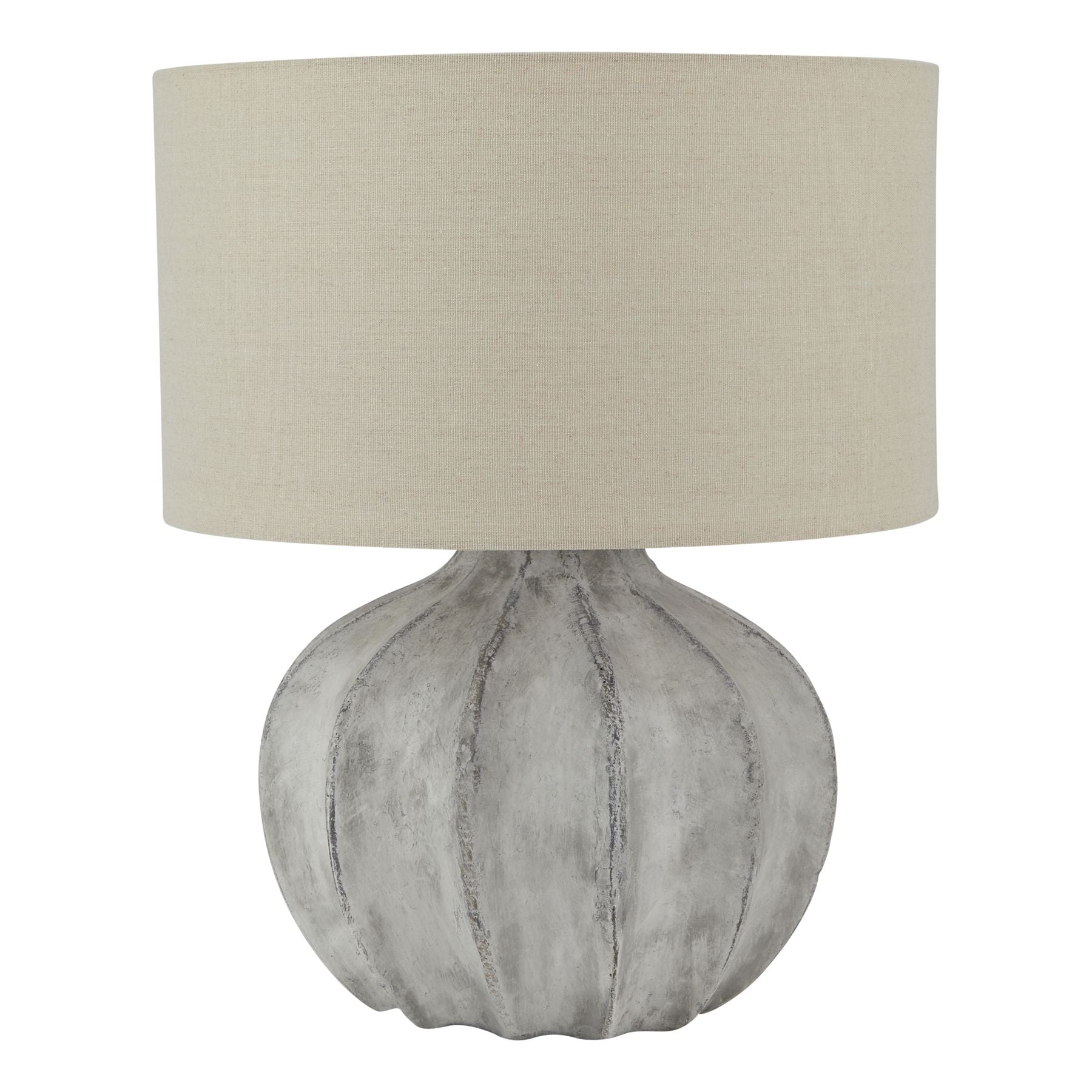 Table lamp with textured gray base and beige lampshade on a white background
