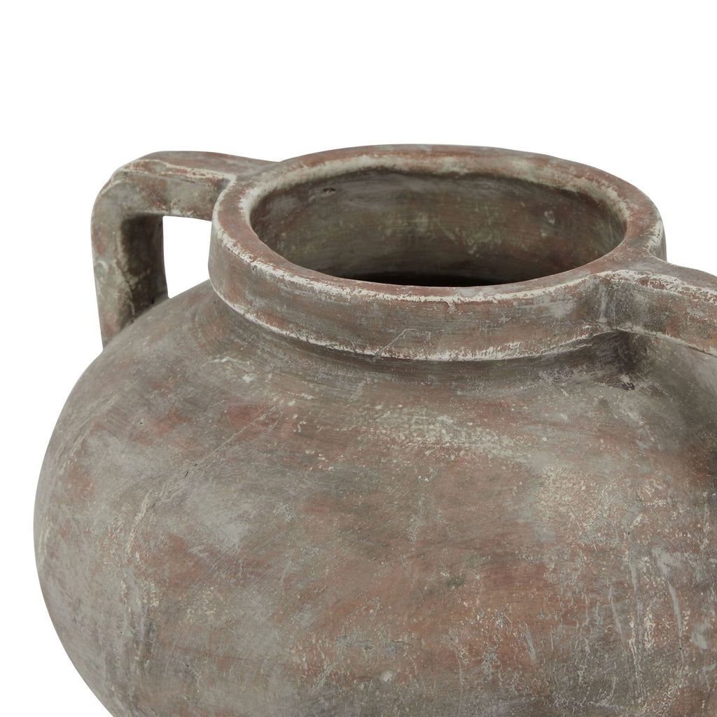 Ancient terracotta jar with handles on a white background