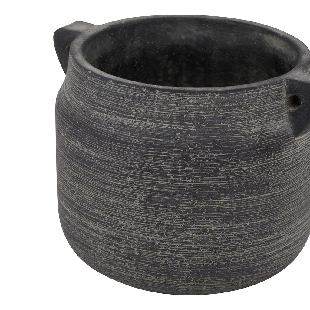 Black ceramic pot with two handles on a white background