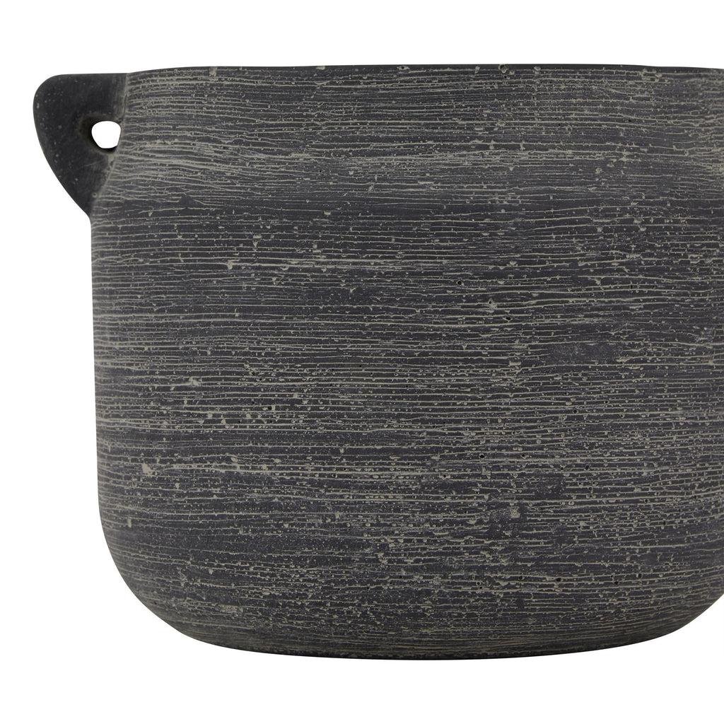 Black textured pot on a white background