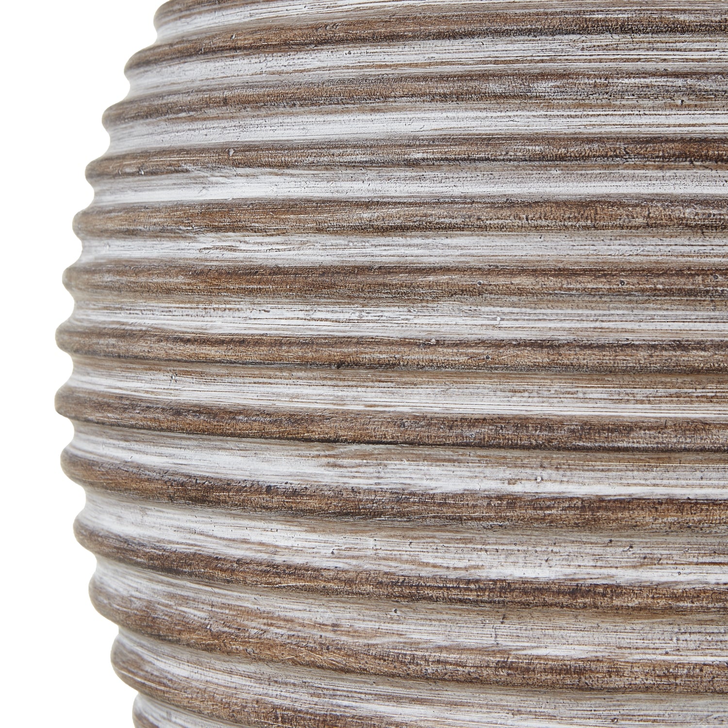 Close-up of a textured vase with horizontal ribbing on a white background