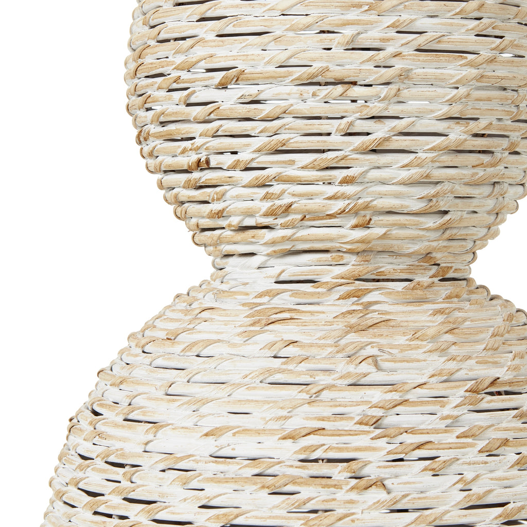 Close-up of a woven rattan stool with a natural pattern on a white background