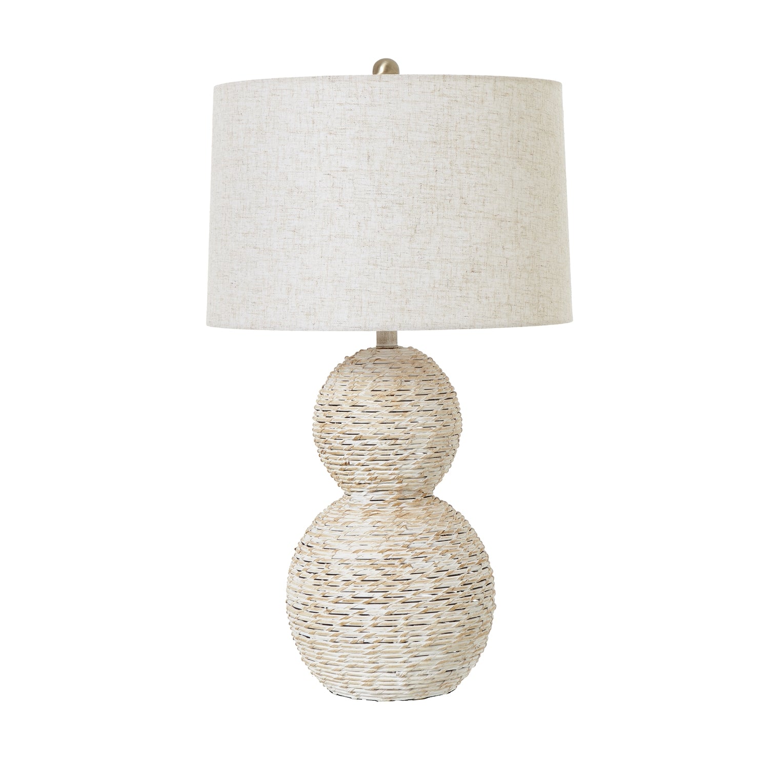 Table lamp with textured base and white shade on a white background