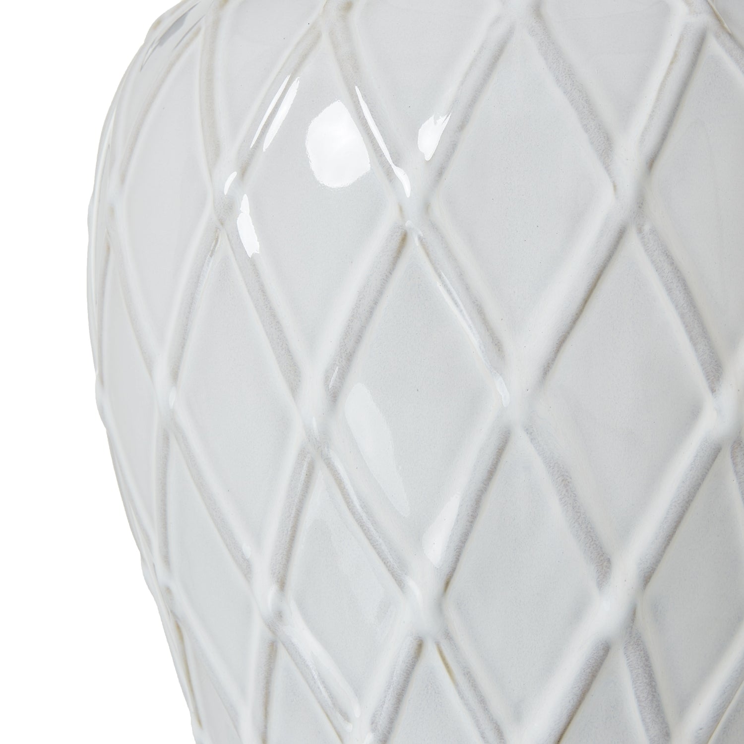 White ceramic vase with geometric lattice pattern on a white background