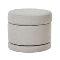 Round gray ottoman with a stackable design on a white background