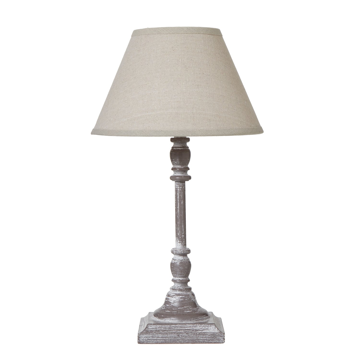Table lamp with a beige shade on a white background