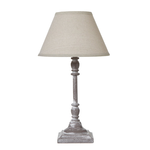 Table lamp with a beige shade on a white background