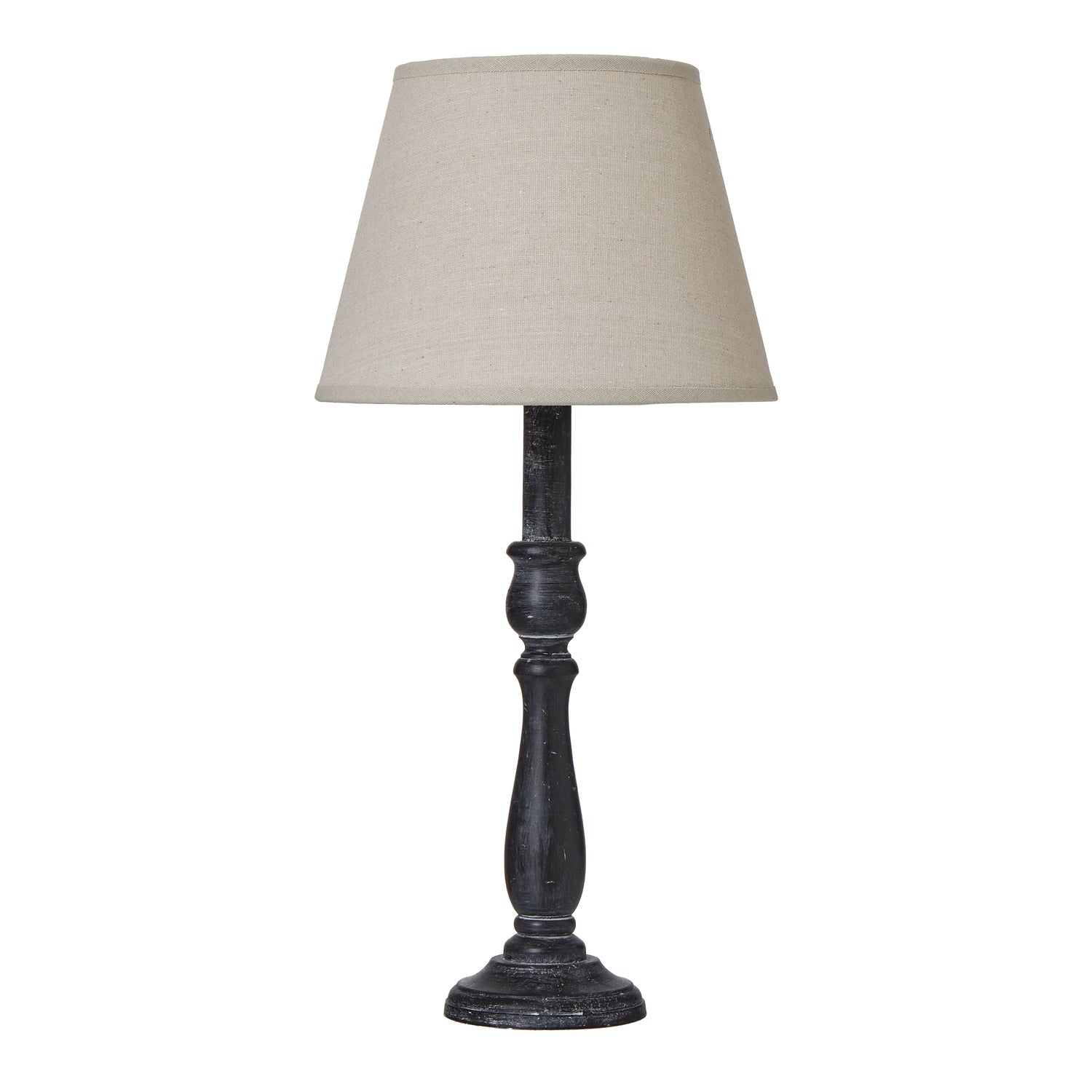 Table lamp with a beige shade and dark wooden base on a white background