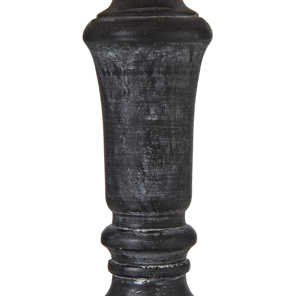Black decorative column on a white background