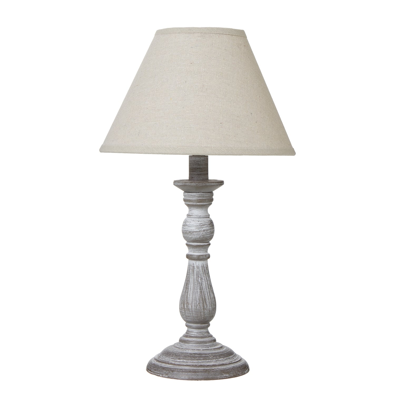 Table lamp with a textured white base and beige lampshade on a white background