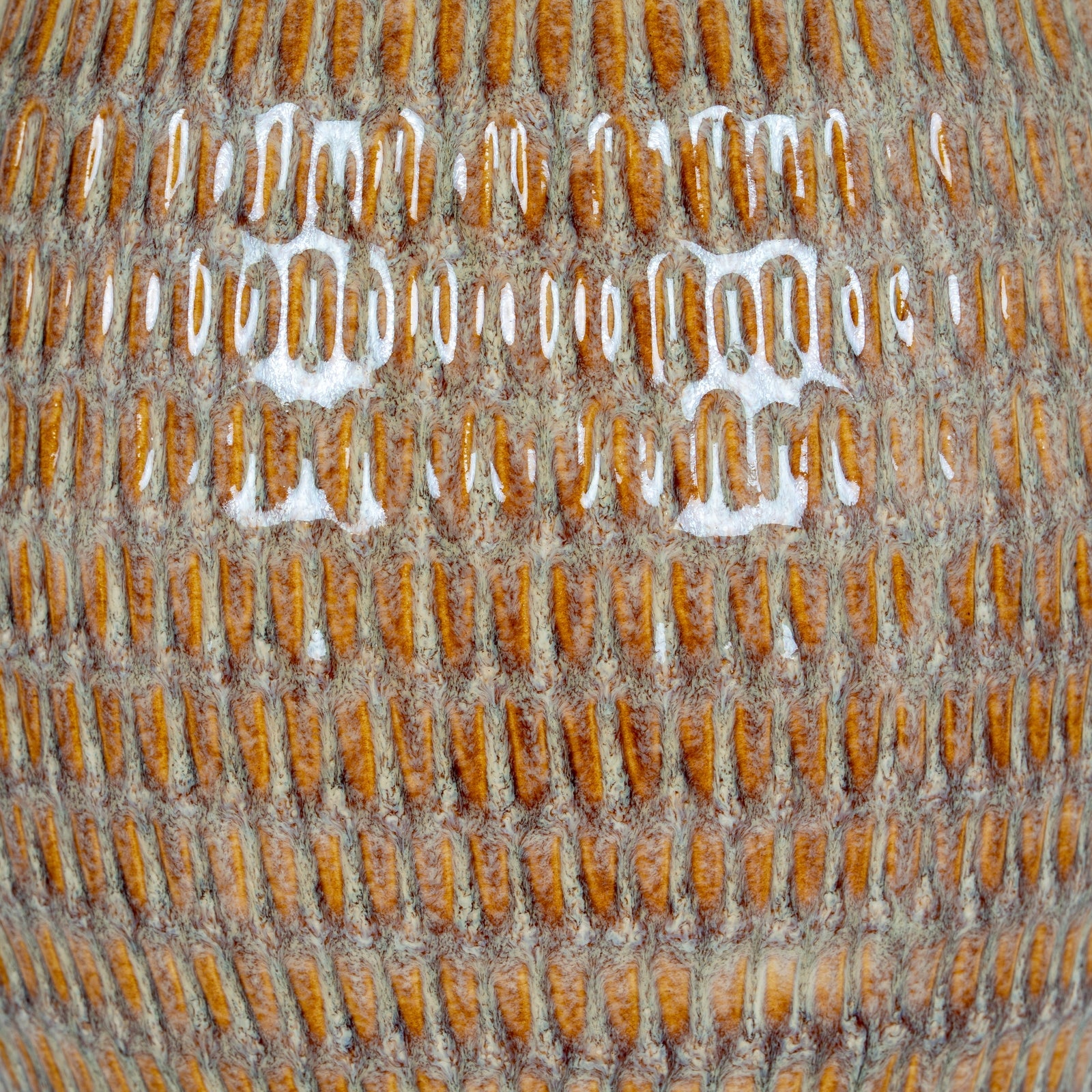 Close-up of a textured surface with a brand logo.