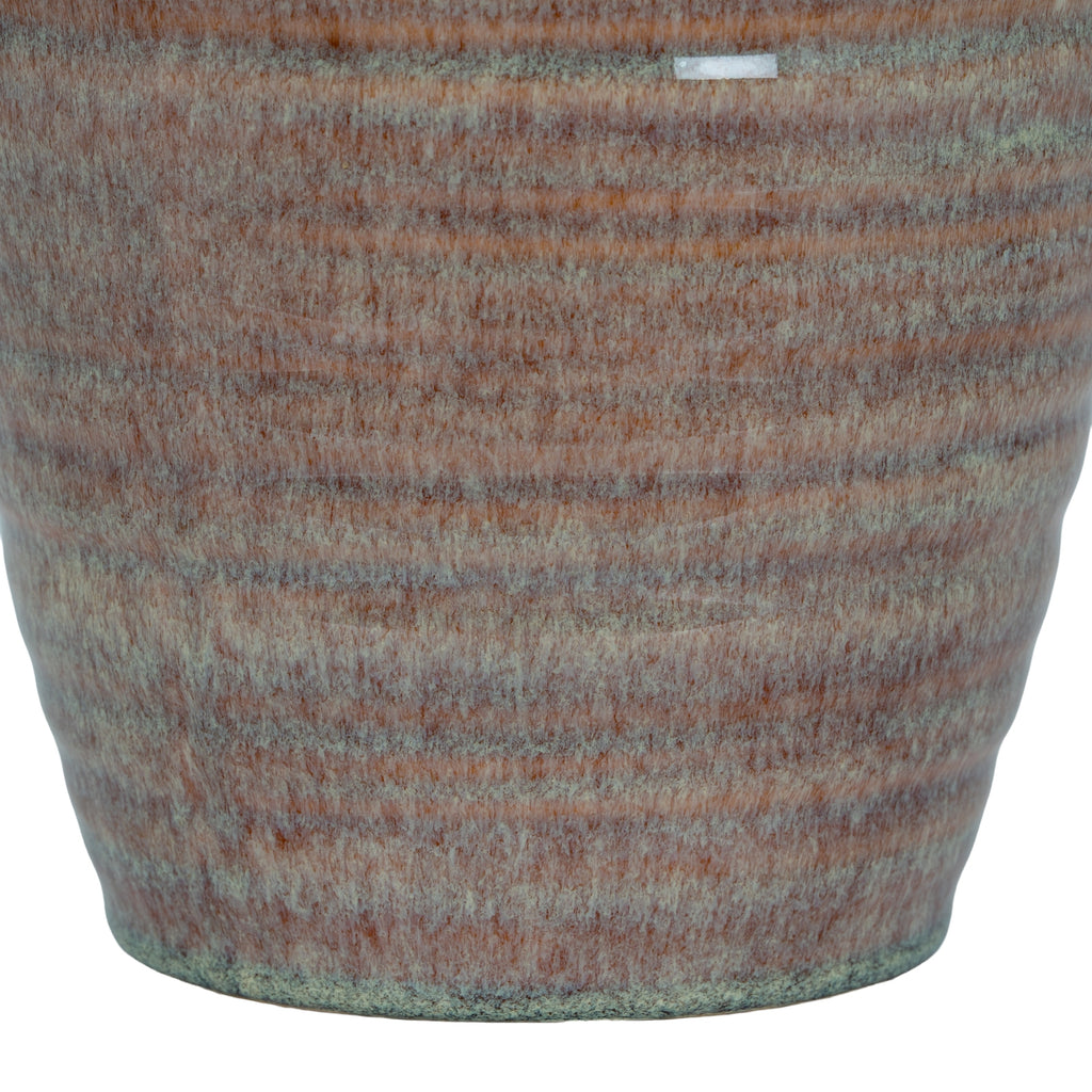 Textured fabric swatch with brown and green pattern on a white background