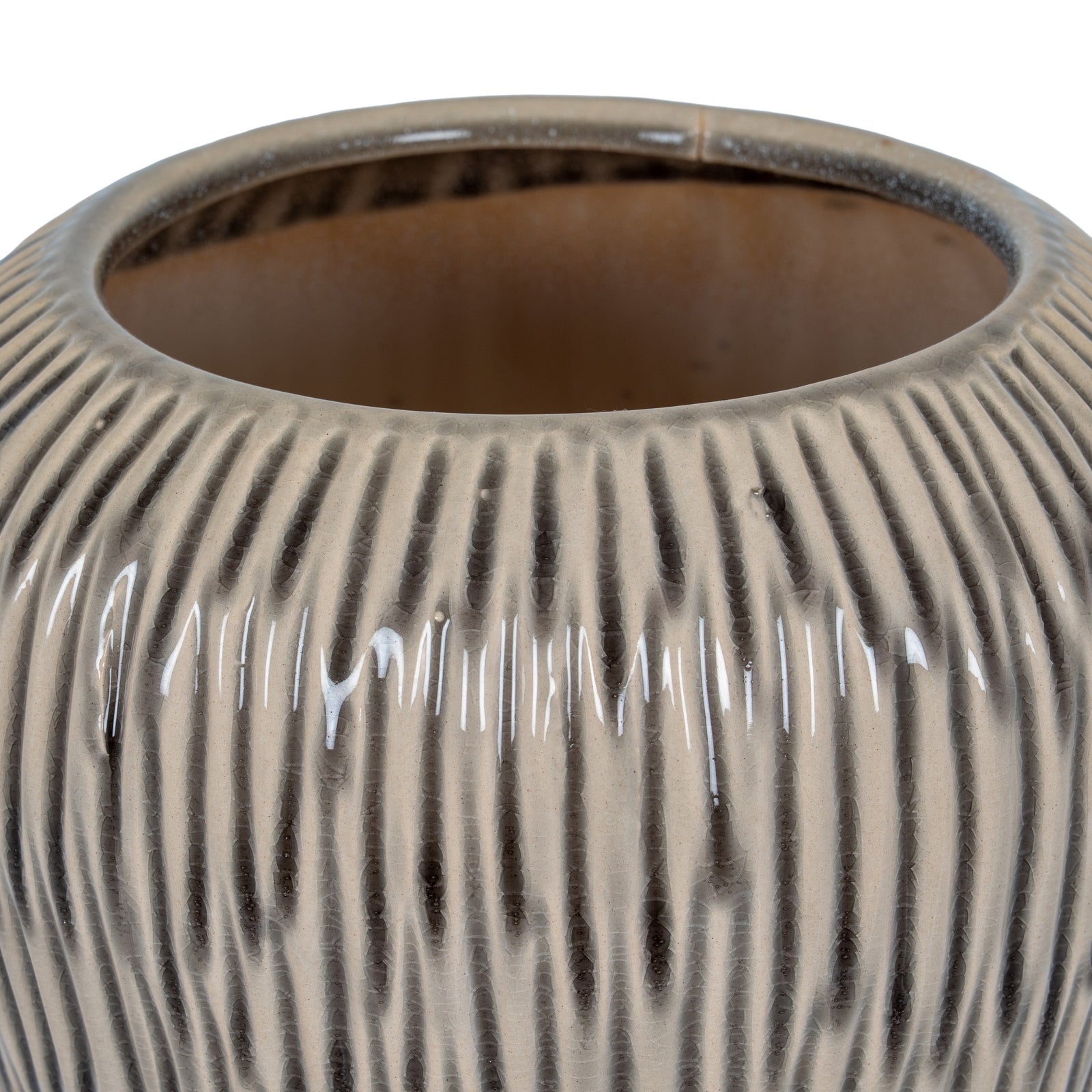 Close-up of a textured ceramic vase on a white background