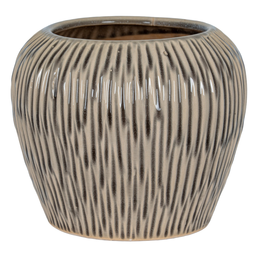 Textured ceramic pot on a white background