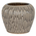 Textured ceramic pot on a white background