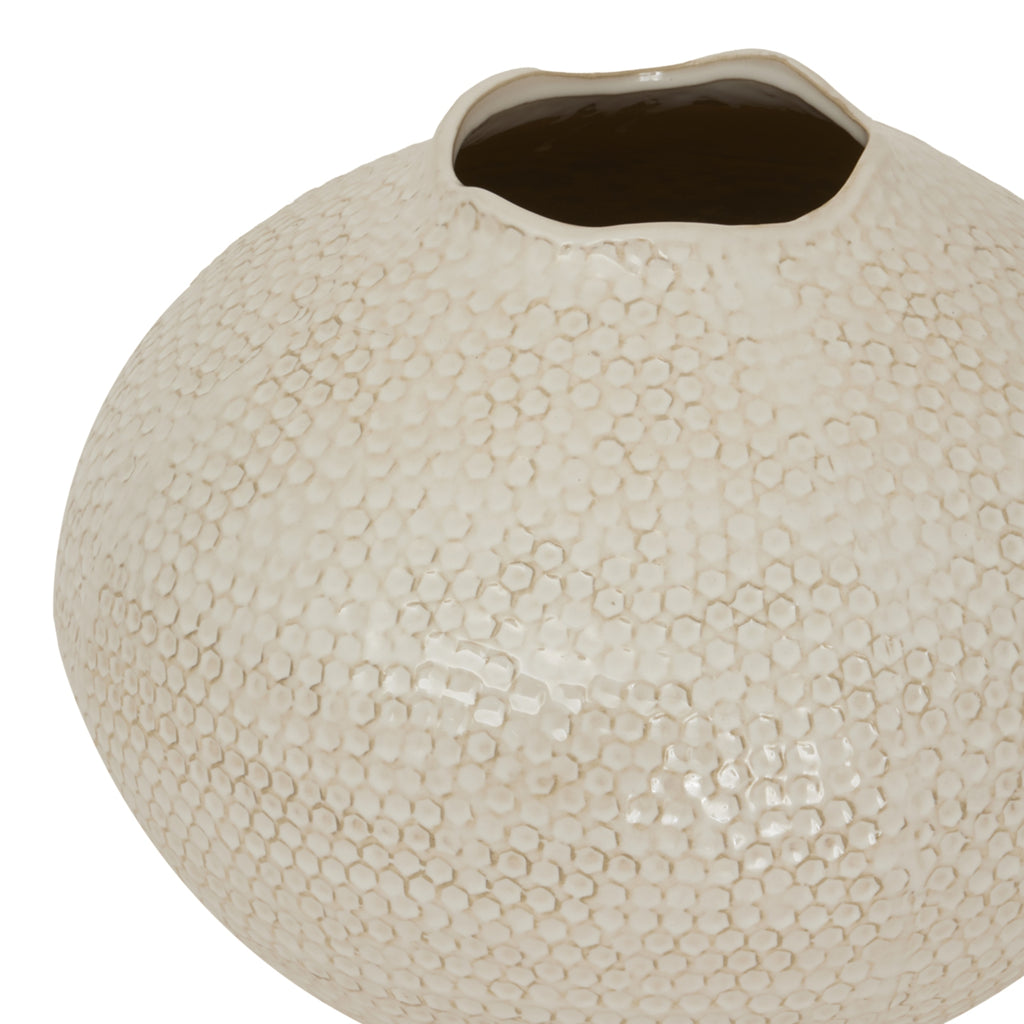 Textured beige ceramic vase on a white background