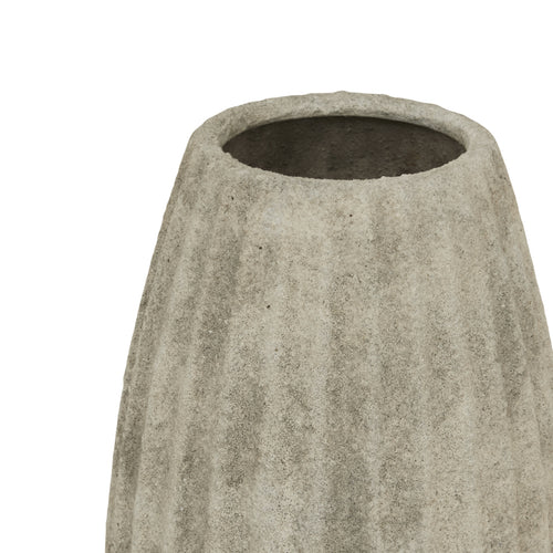 Concrete planter with textured surface on a white background