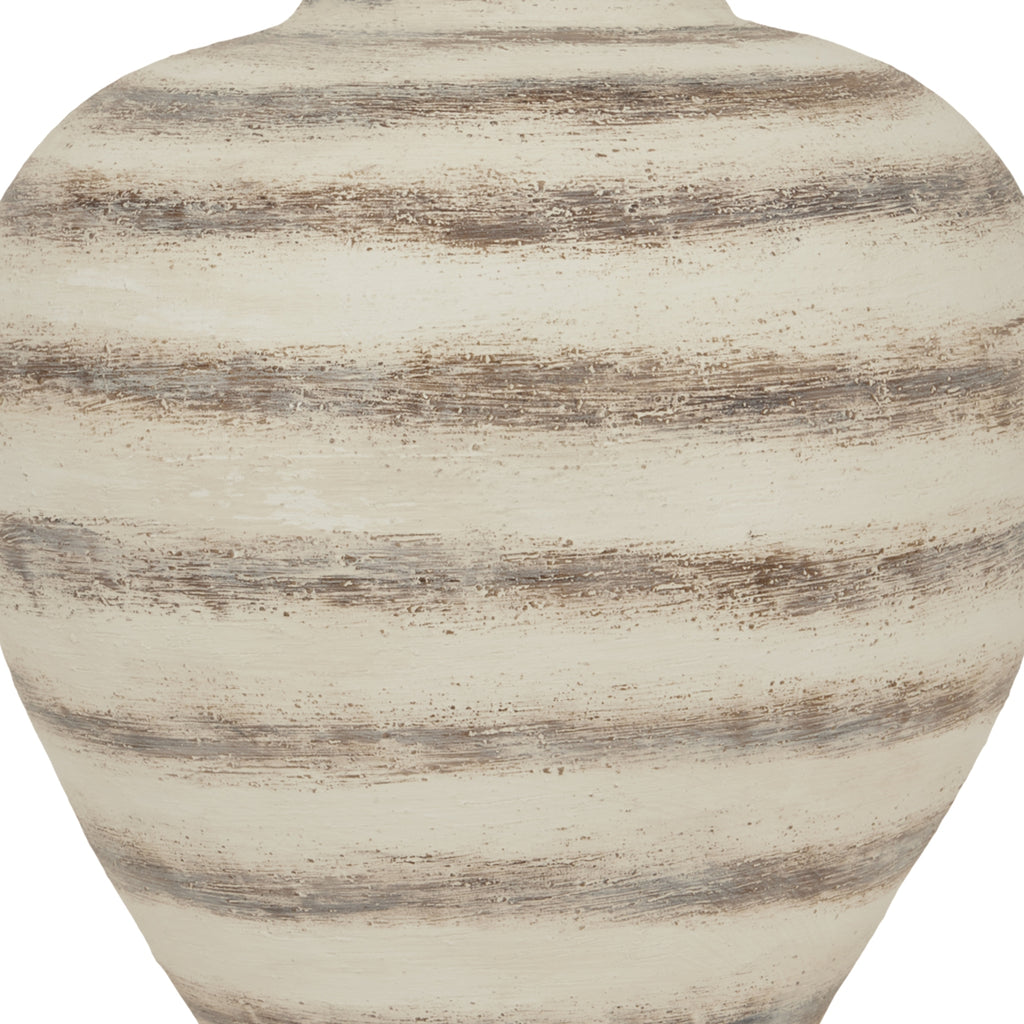 Close-up of a textured ceramic vase with horizontal stripes on a white background