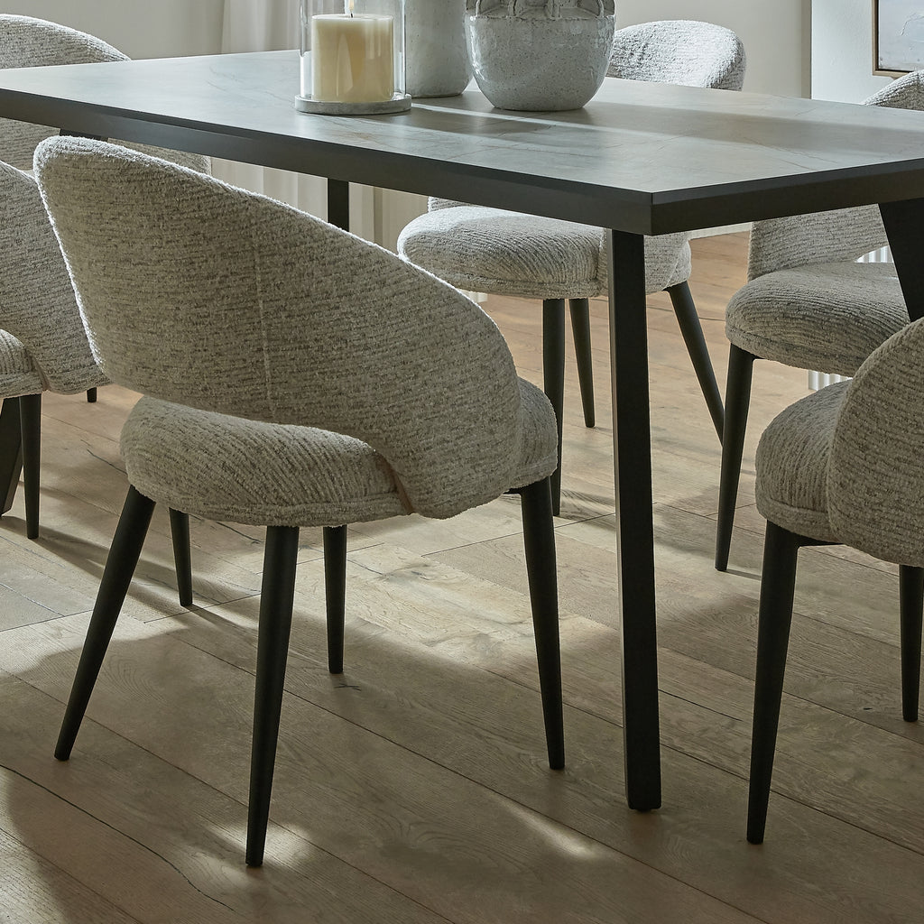 Dining table with chairs in a well-lit room