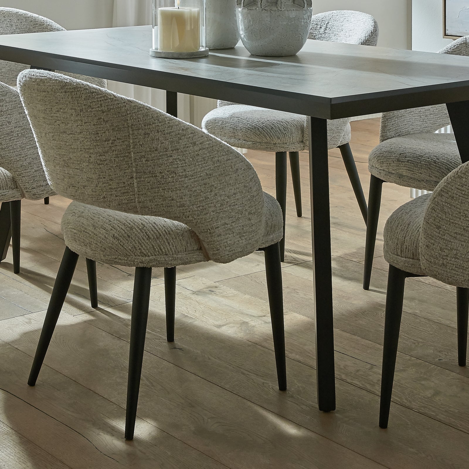 Dining table with chairs in a well-lit room