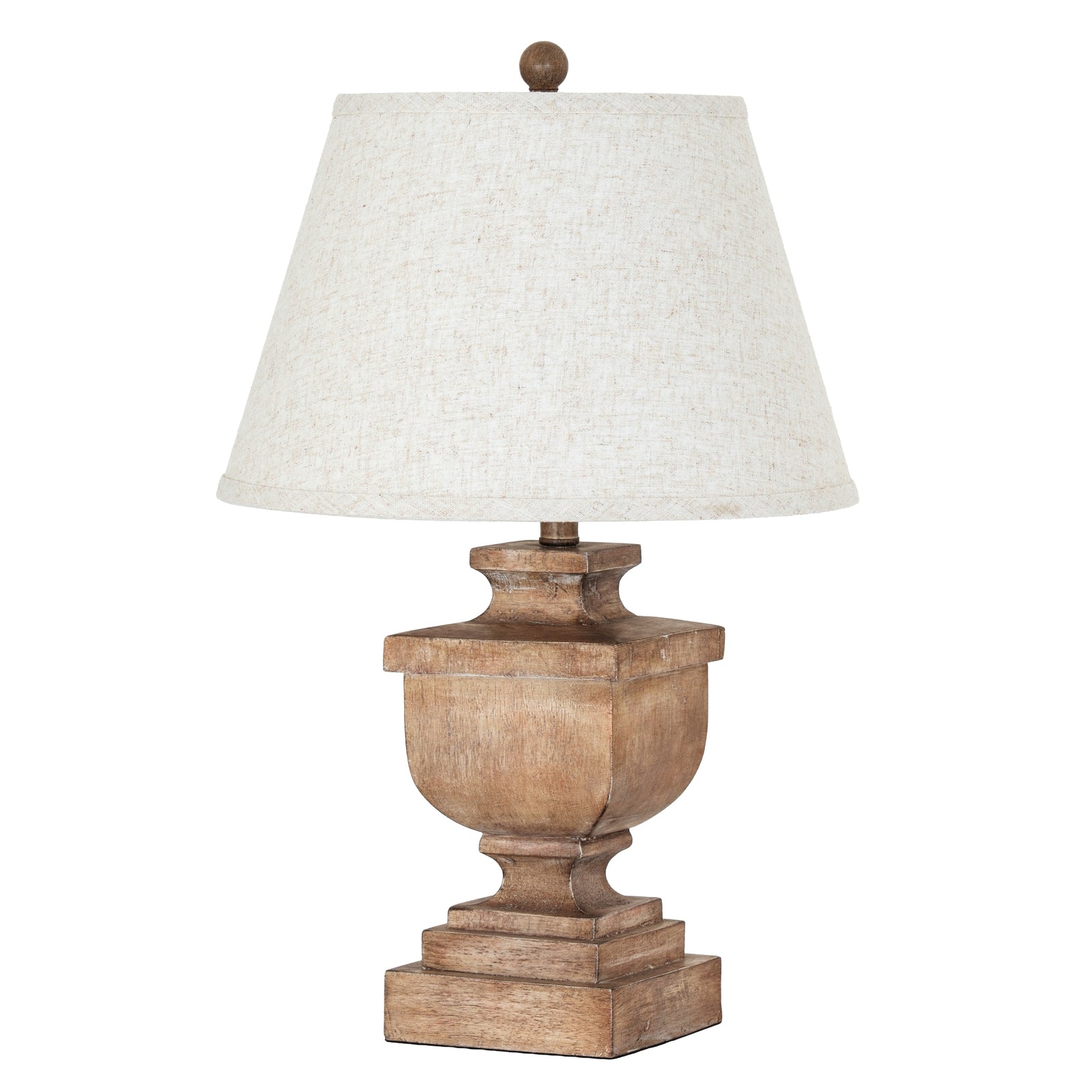 Table lamp with wooden base and white shade on a white background