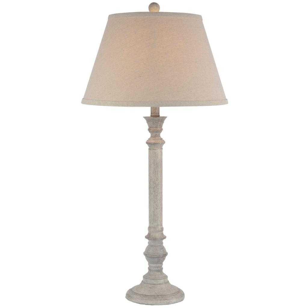 Table lamp with beige shade on a white background